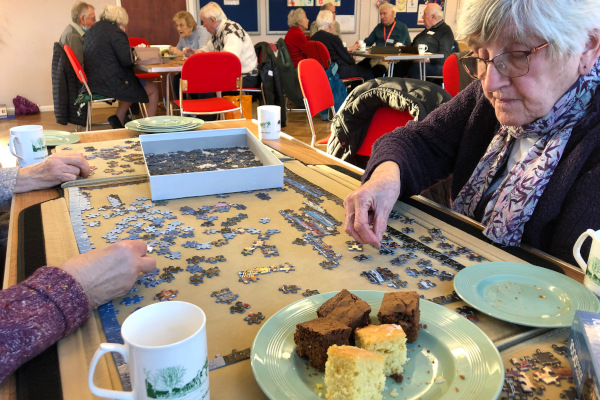 Cake and working on jigsaw puzzle